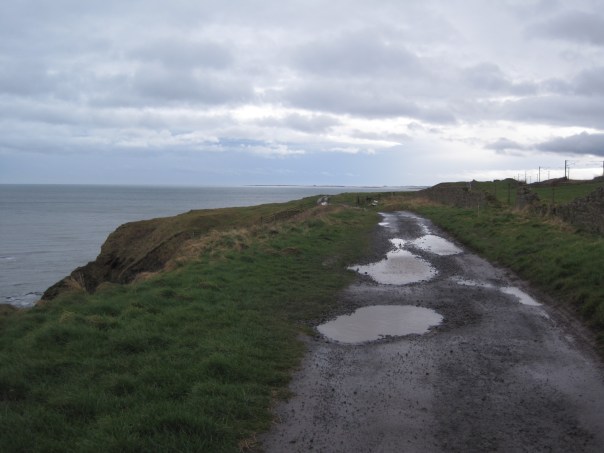 Start of the route proper, Bamburgh and Holy island castles small blobs on the horizon